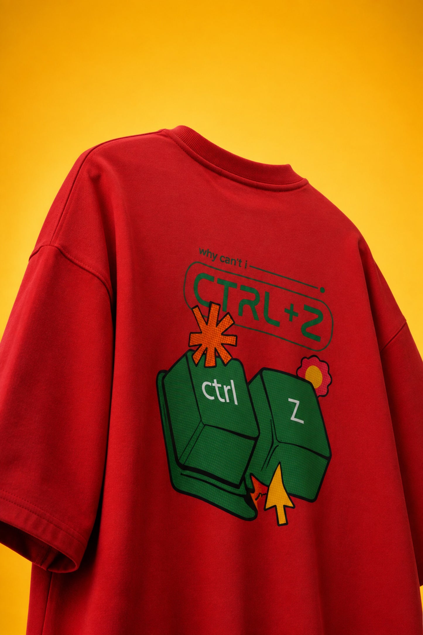 Red oversized t-shirt with Ctrl+Z shortcut print in teal green on left chest, quirky streetwear India