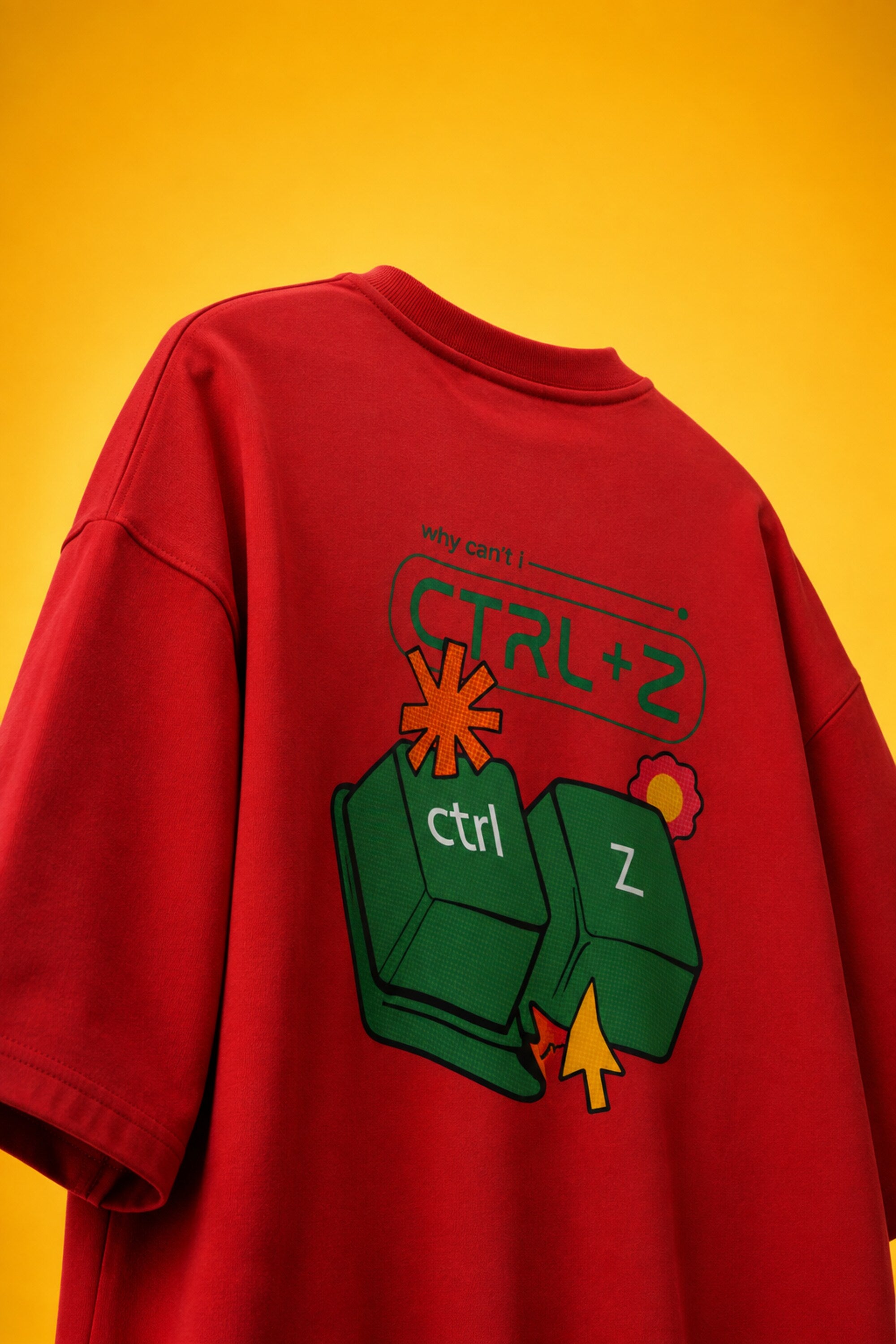 Red oversized t-shirt with Ctrl+Z shortcut print in teal green on left chest, quirky streetwear India
