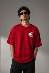 CHAL brand red oversized t-shirt with white graphic print of dice and text. Model wearing the t-shirt to showcase the relaxed, oversized fit. - red