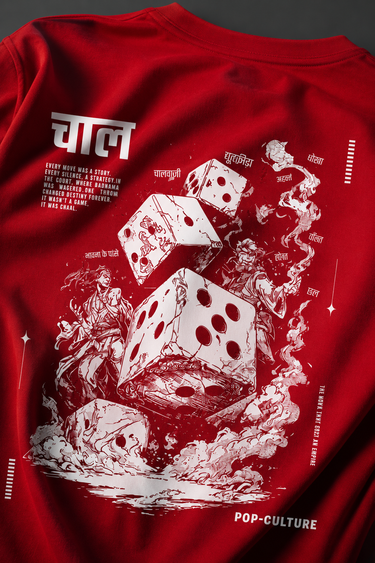 CHAL brand red oversized t-shirt with white graphic print of dice and text. Model wearing the t-shirt to showcase the relaxed, oversized fit.