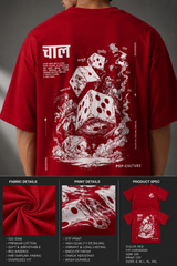 CHAL brand red oversized t-shirt with white graphic print of dice and text. Model wearing the t-shirt to showcase the relaxed, oversized fit.