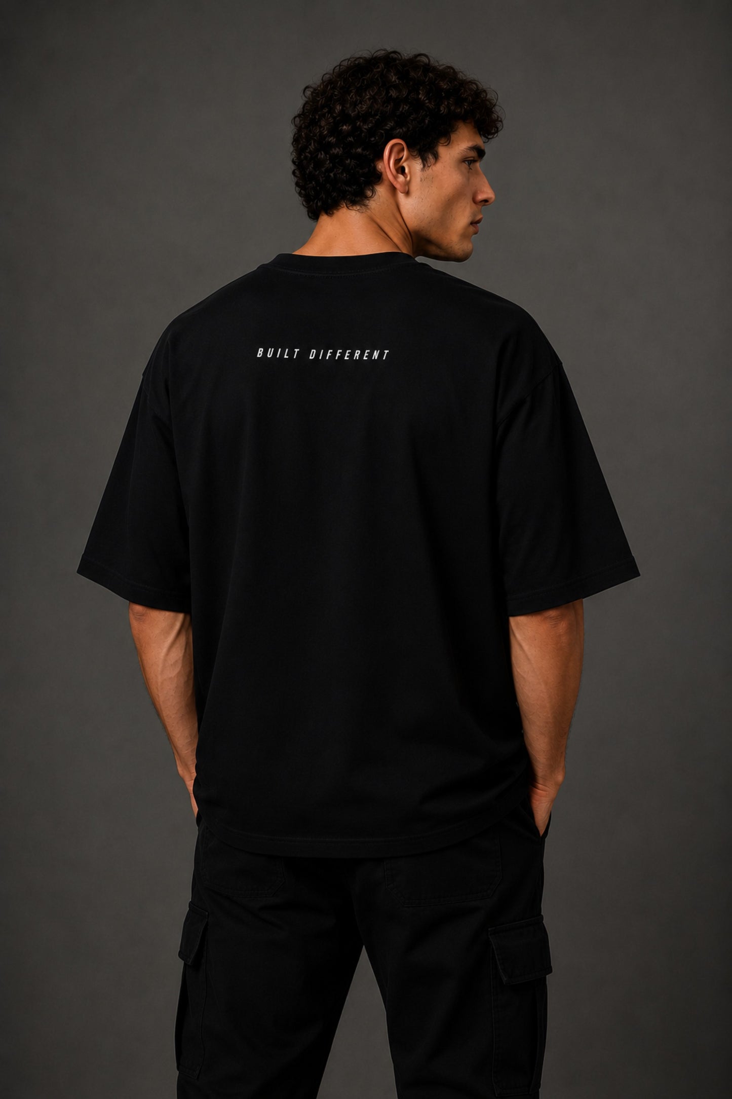 Black oversized t-shirt with 'Chicago' graphic print and racing-inspired logos. Offers premium streetwear style.