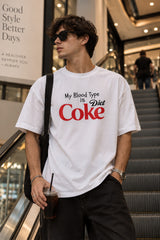 White oversized tshirt with My Blood Type is Diet Coke slogan in red and black Coke-style print on chest, boxy fit, men India