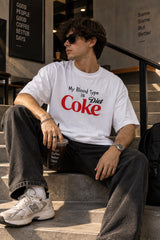 White oversized tshirt with My Blood Type is Diet Coke slogan in red and black Coke-style print on chest, boxy fit, men India