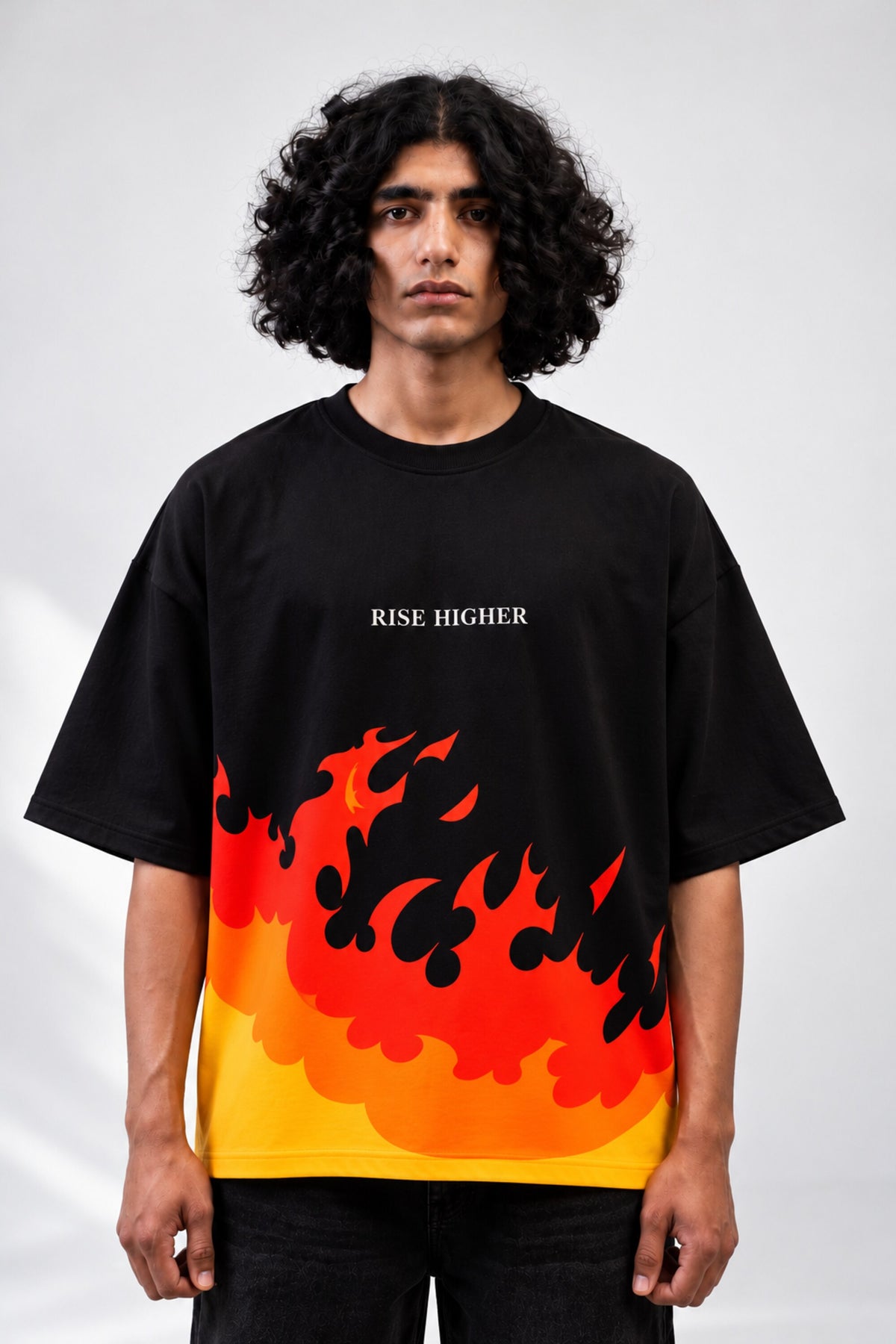 Black oversized tshirt with orange red rising flame wall from hem and Rise Higher text on chest, drop shoulder boxy fit, men India