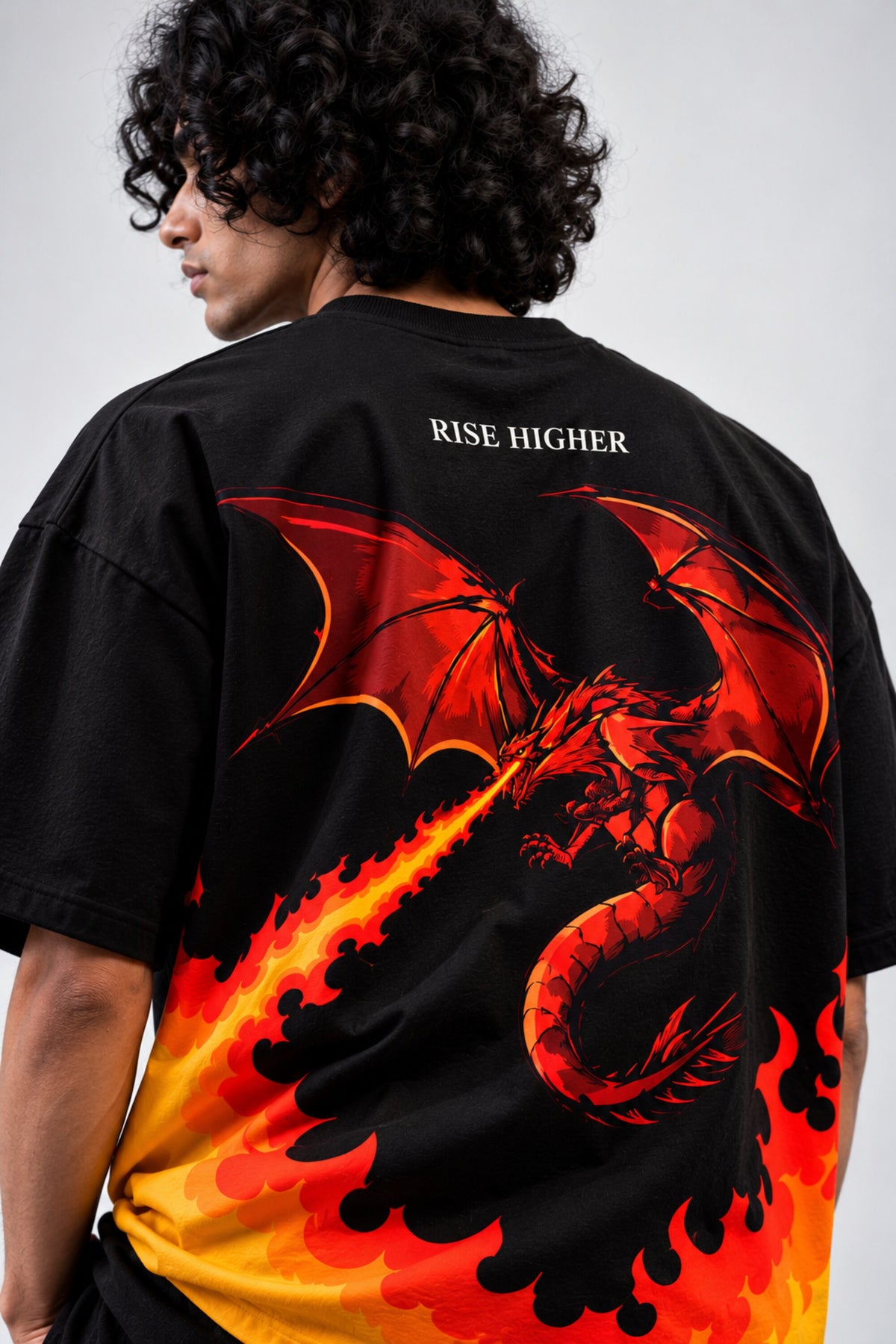 Black oversized tshirt with orange red rising flame wall from hem and Rise Higher text on chest, drop shoulder boxy fit, men India