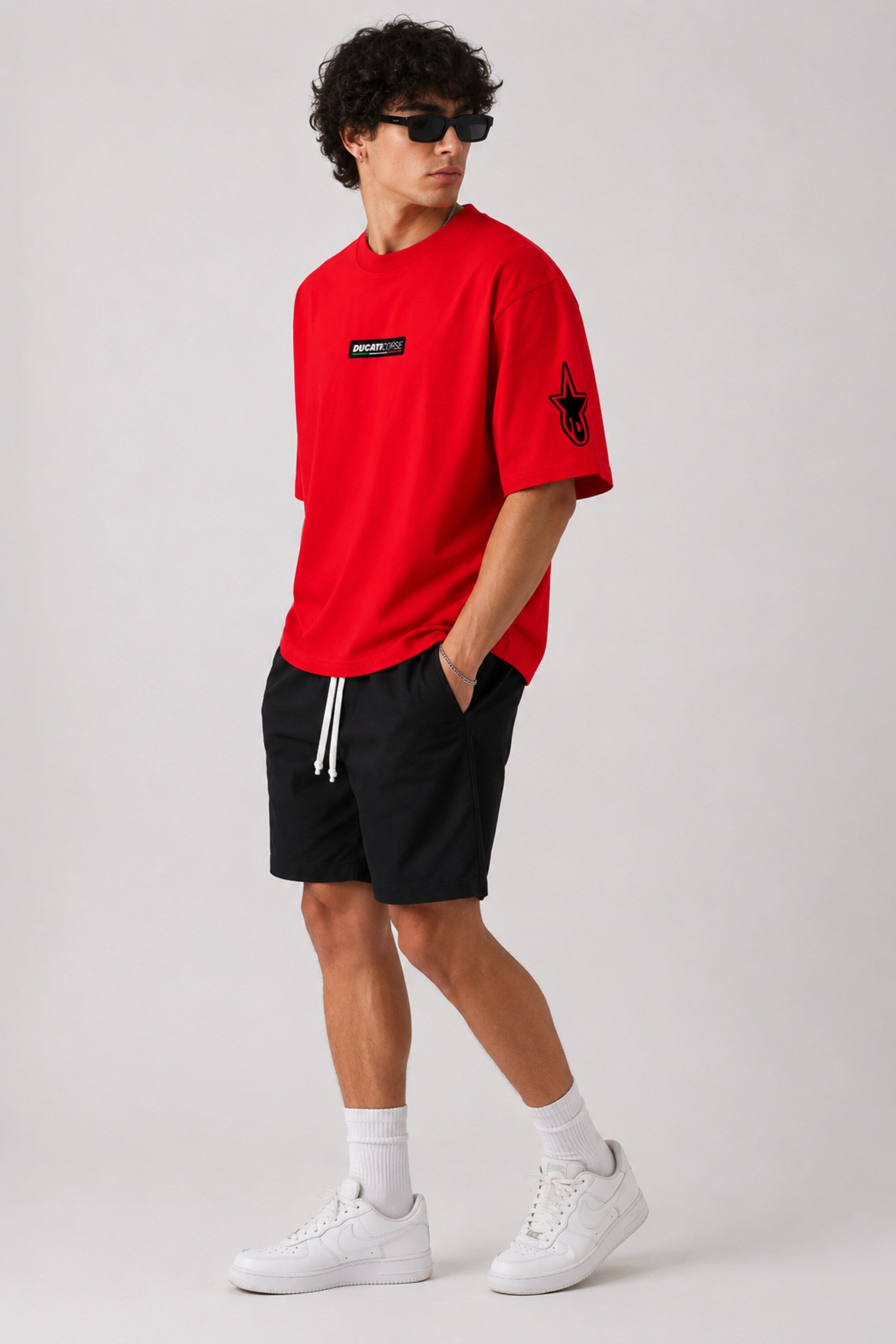 POPCASE red oversized t shirt Ducati Corse badge front Alpinestars sleeve Ducati Panigale V4 motorcycle back Motul graphic streetwear tshirt