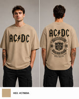 Man wearing a beige AC/DC t-shirt with front and back designs on a gray background