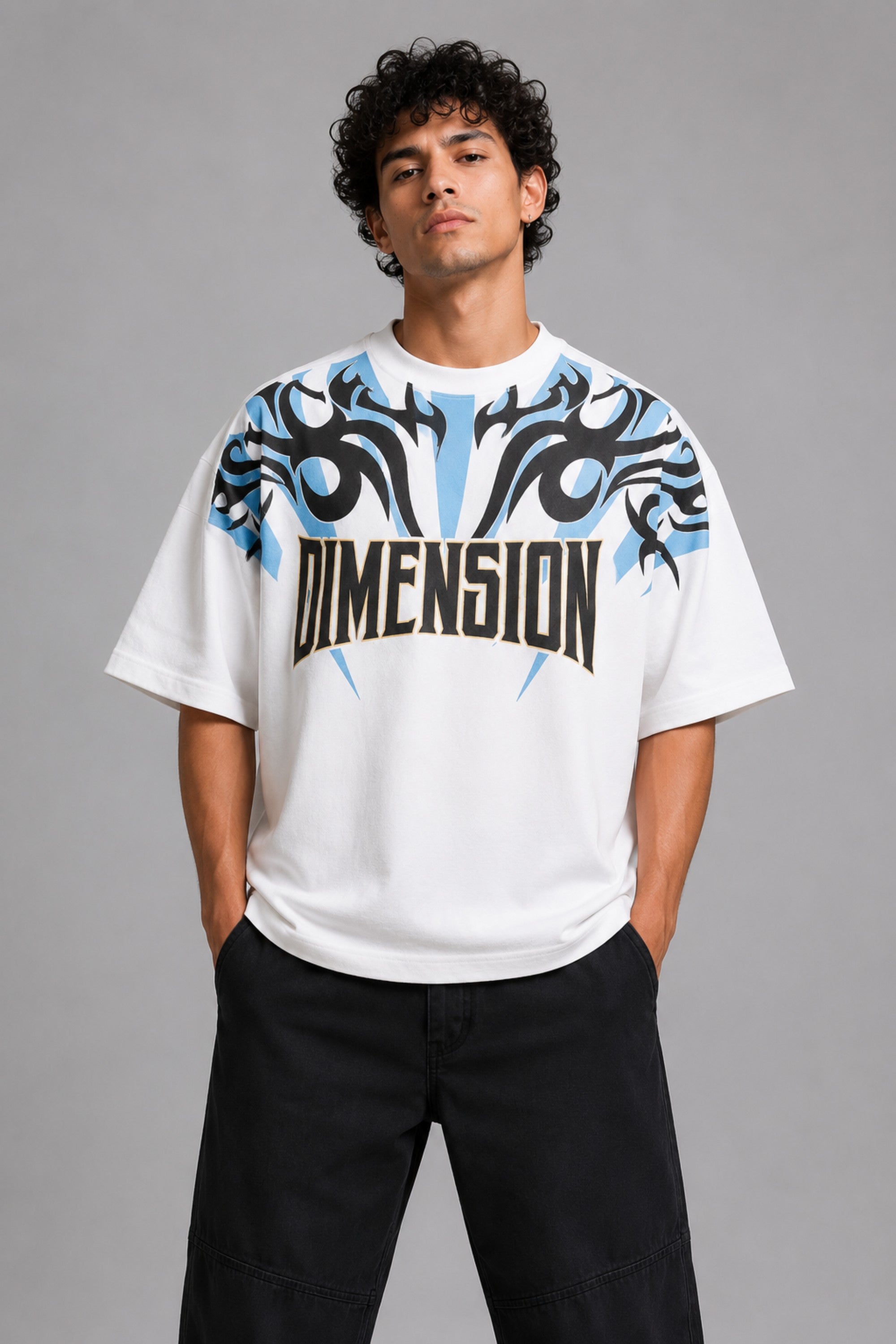Model wearing a white DIMENSION oversized t-shirt with a black and blue graphic print and a silver chain necklace. - white