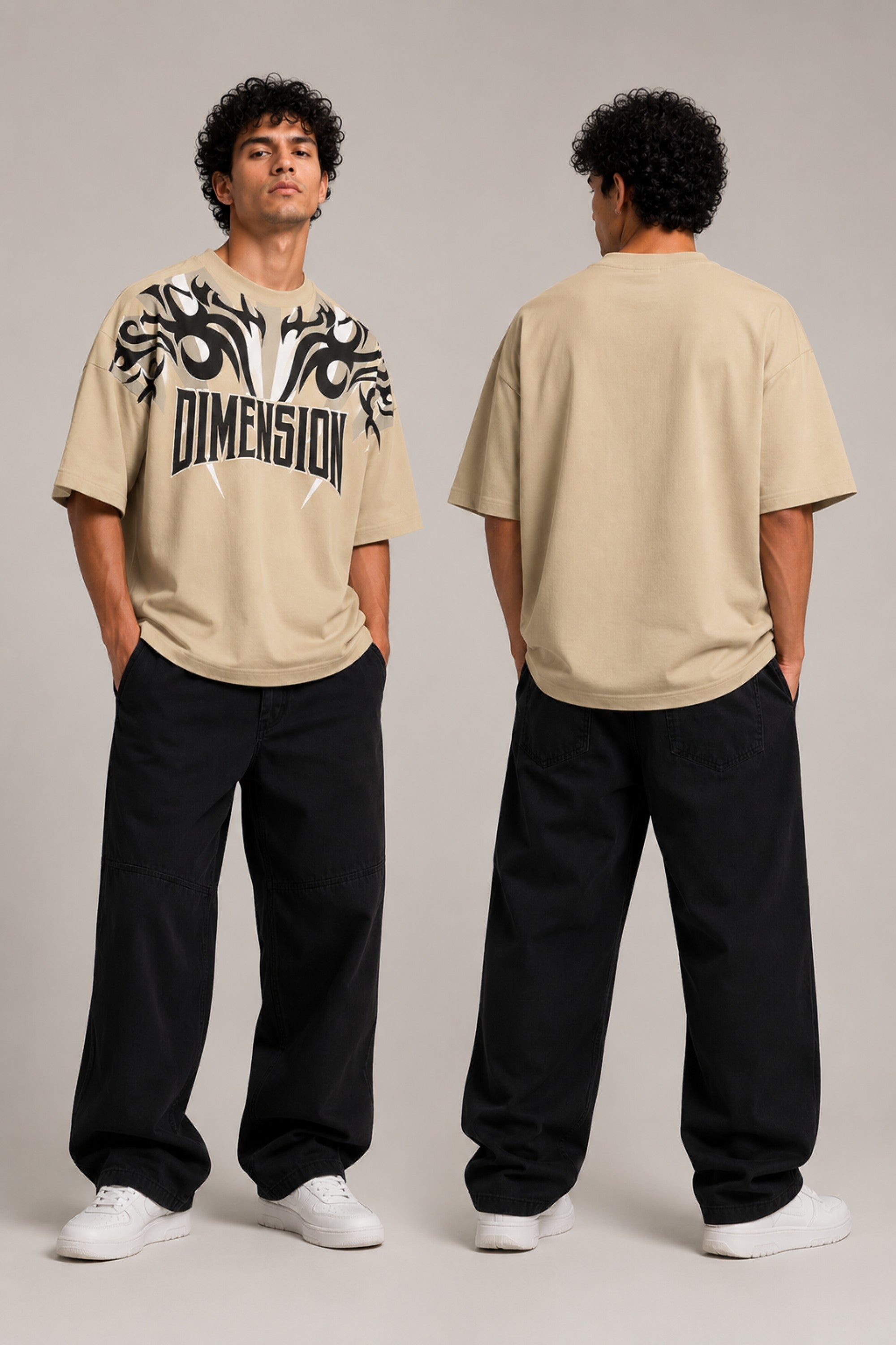 Model wearing a white DIMENSION oversized t-shirt with a black and blue graphic print and a silver chain necklace. - beige