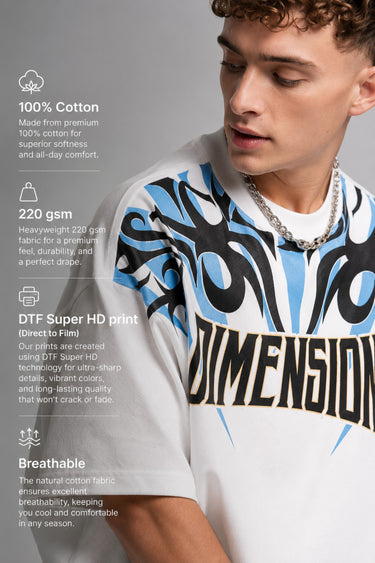 Model wearing a white DIMENSION oversized t-shirt with a black and blue graphic print and a silver chain necklace.