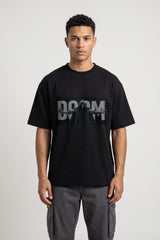 Black oversized tshirt with DOOM green text on front and hooded skull villain back print, drop shoulder boxy fit, men India