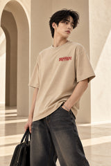 Beige Ferrari oversized tshirt with small red Ferrari logo print on left chest, relaxed drop shoulder boxy fit, men India
