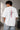 POPCASE white oversized t shirt Ferrari F1 racing front vertical red Ferrari text prancing horse watermark back POPCASE branding premium cotton