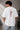 POPCASE white oversized t shirt Ferrari F1 racing livery Bridgestone 16 44 checkered flag Scuderia Ferrari shield bold text graphic tshirt