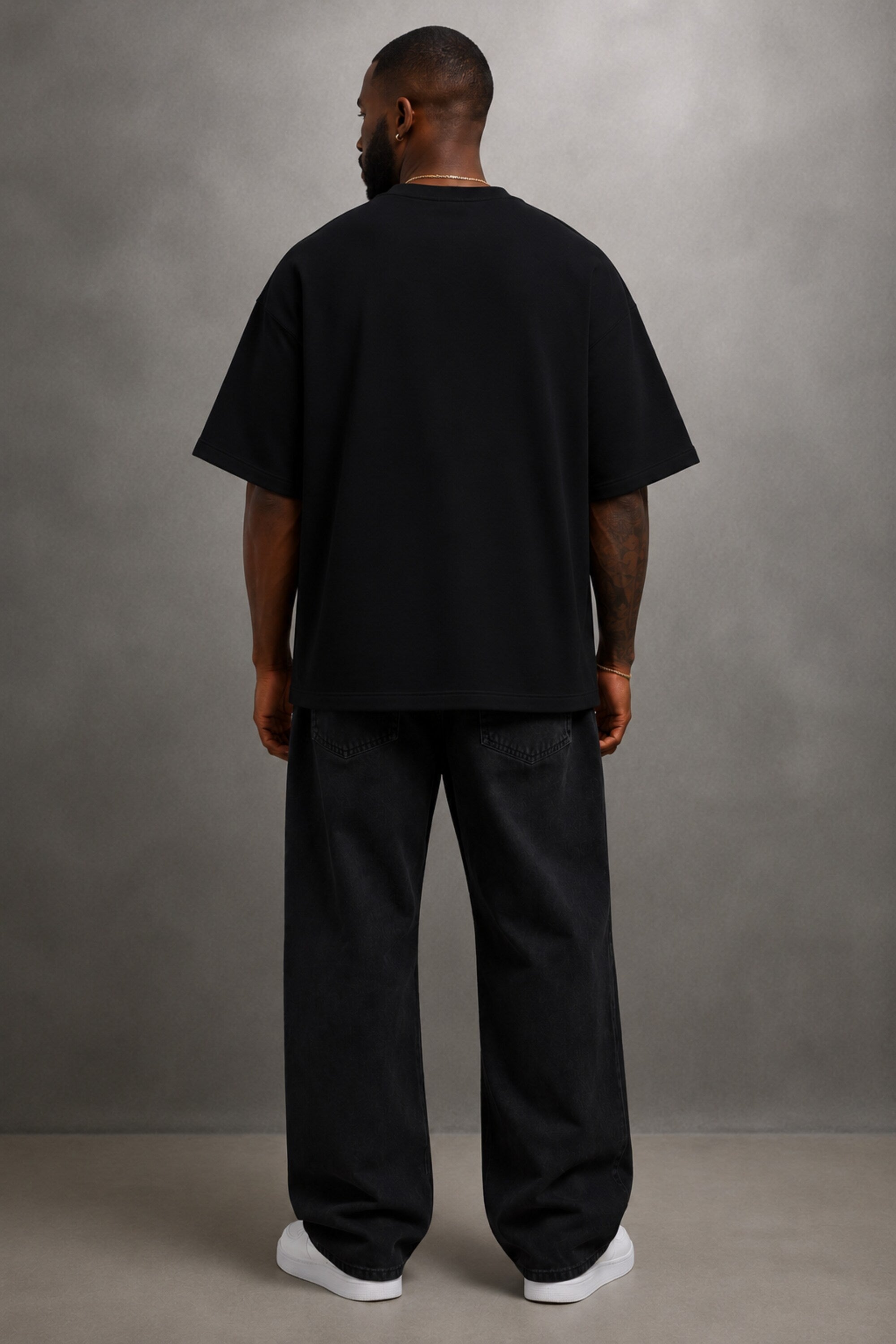 Black oversized t-shirt with large white outline flame design on front, streetwear fashion India