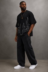 Black oversized t-shirt with large white outline flame design on front, streetwear fashion India