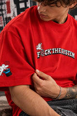 Red oversized tshirt with F*ck The System white slogan print on front and anarchy motifs on sleeves, drop shoulder boxy fit, men India