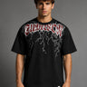 Guardian Design black oversized t-shirt with a bold red and white lightning bolt graphic print. Shot on a model, showcasing the relaxed, streetwear fit.
