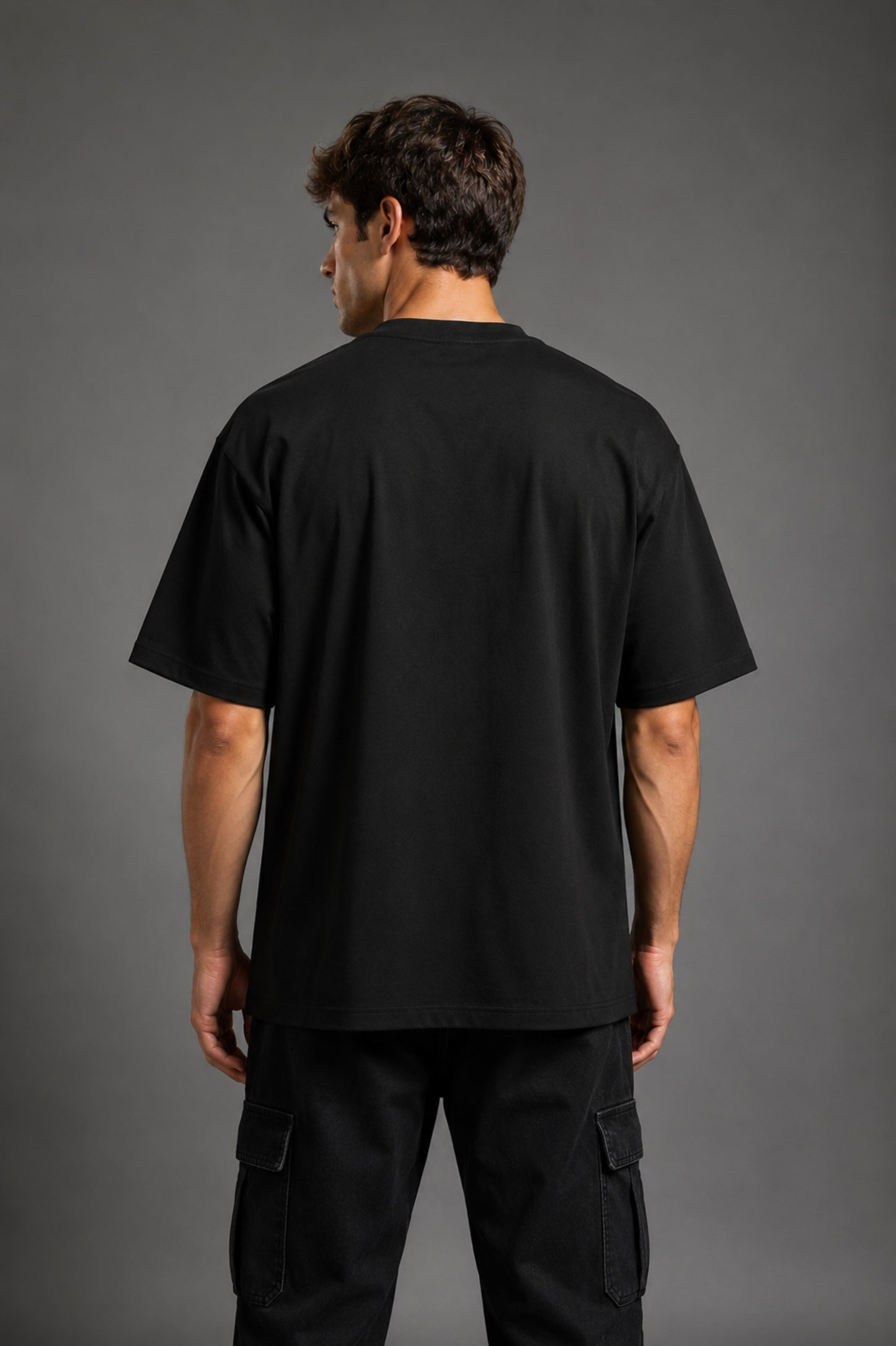 Guardian Design black oversized t-shirt with a bold red and white lightning bolt graphic print. Shot on a model, showcasing the relaxed, streetwear fit.