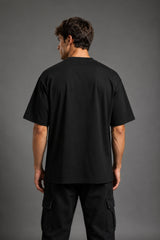 Guardian Design black oversized t-shirt with a bold red and white lightning bolt graphic print. Shot on a model, showcasing the relaxed, streetwear fit.