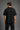Guardian Design black oversized t-shirt with a bold red and white lightning bolt graphic print. Shot on a model, showcasing the relaxed, streetwear fit.