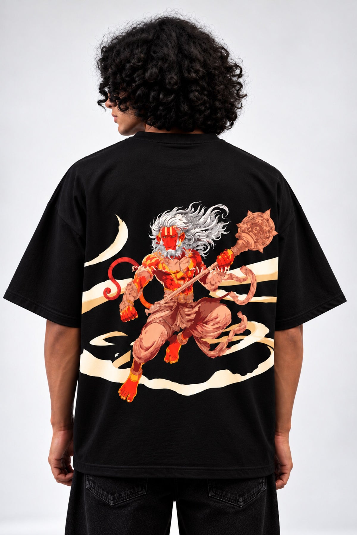 Black oversized tshirt with vibrant full-back Hanuman warrior illustration in orange red and gold, drop shoulder boxy fit, men India