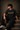 Man wearing an anthracite black 85-DENIM oversized t-shirt featuring a vibrant Hanumanji graphic print and Hindi text 'Mahabali' on the back. Styled for streetwear.