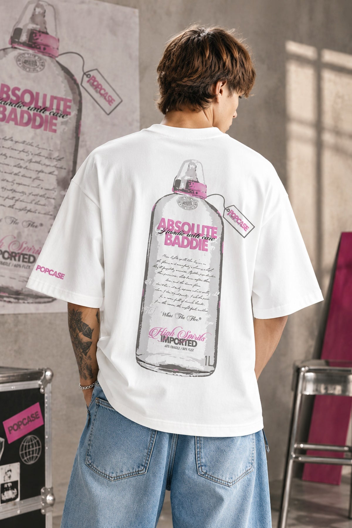 White oversized tshirt with High Spirits pink cursive front and Absolute Baddie vodka bottle back print, drop shoulder boxy fit, men India - white