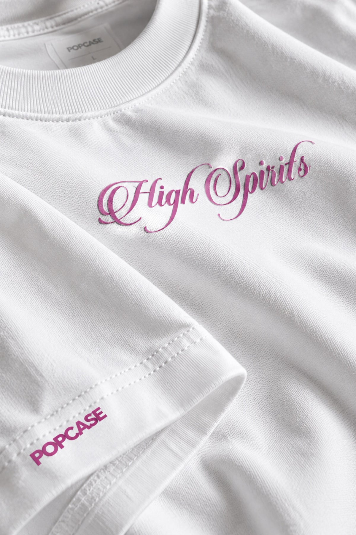 White oversized tshirt with High Spirits pink cursive front and Absolute Baddie vodka bottle back print, drop shoulder boxy fit, men India