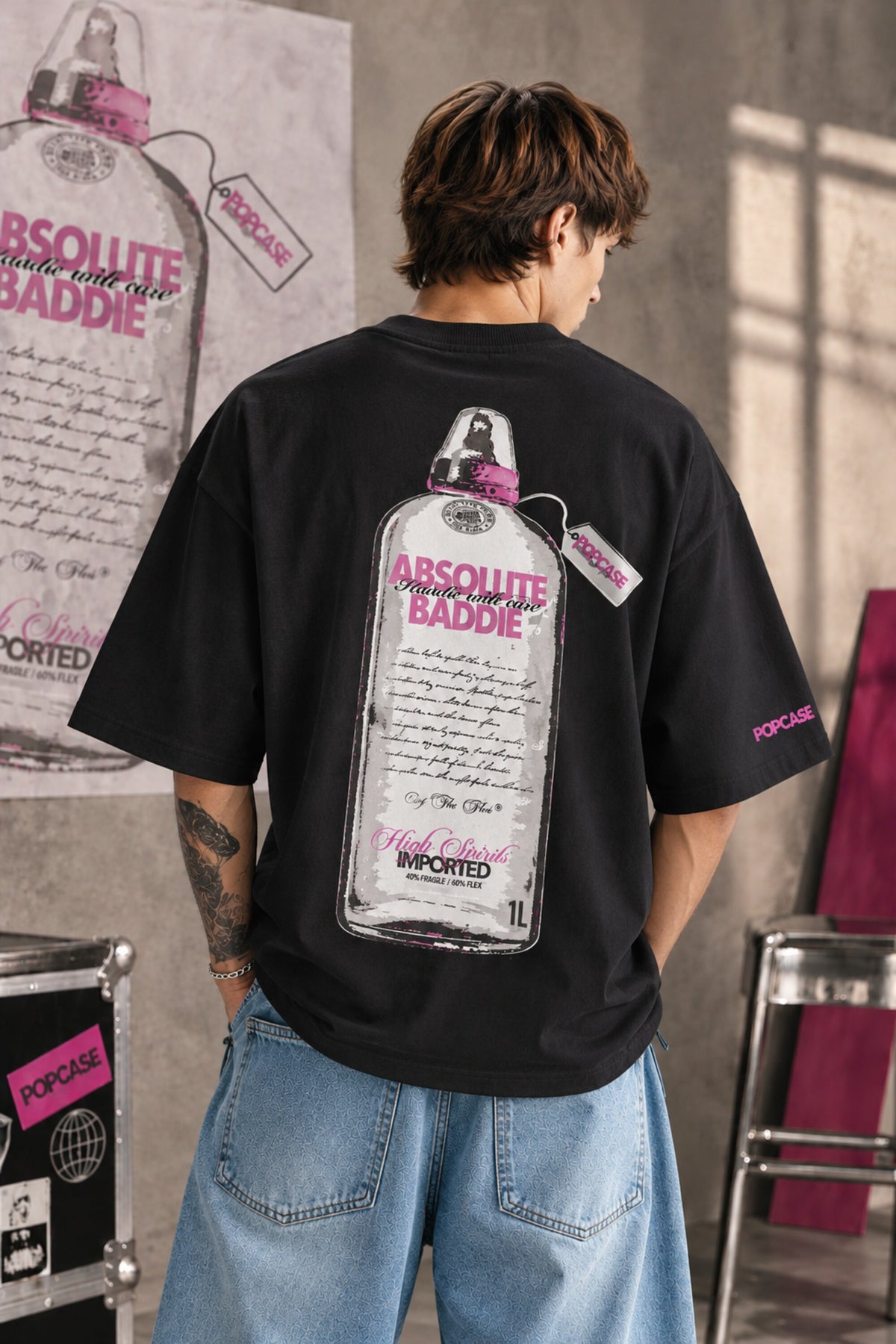 White oversized tshirt with High Spirits pink cursive front and Absolute Baddie vodka bottle back print, drop shoulder boxy fit, men India - black