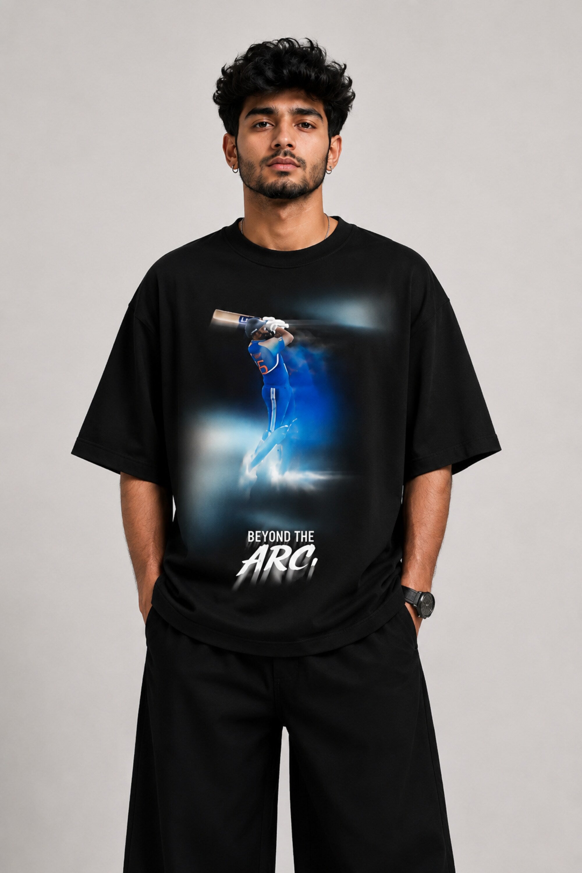 Black oversized t-shirt with cinematic Rohit Sharma Hitman batting photo blue glow Beyond the ARCi bold text 220 GSM DTF print