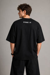 Black oversized t-shirt with cinematic Rohit Sharma Hitman batting photo blue glow Beyond the ARCi bold text 220 GSM DTF print
