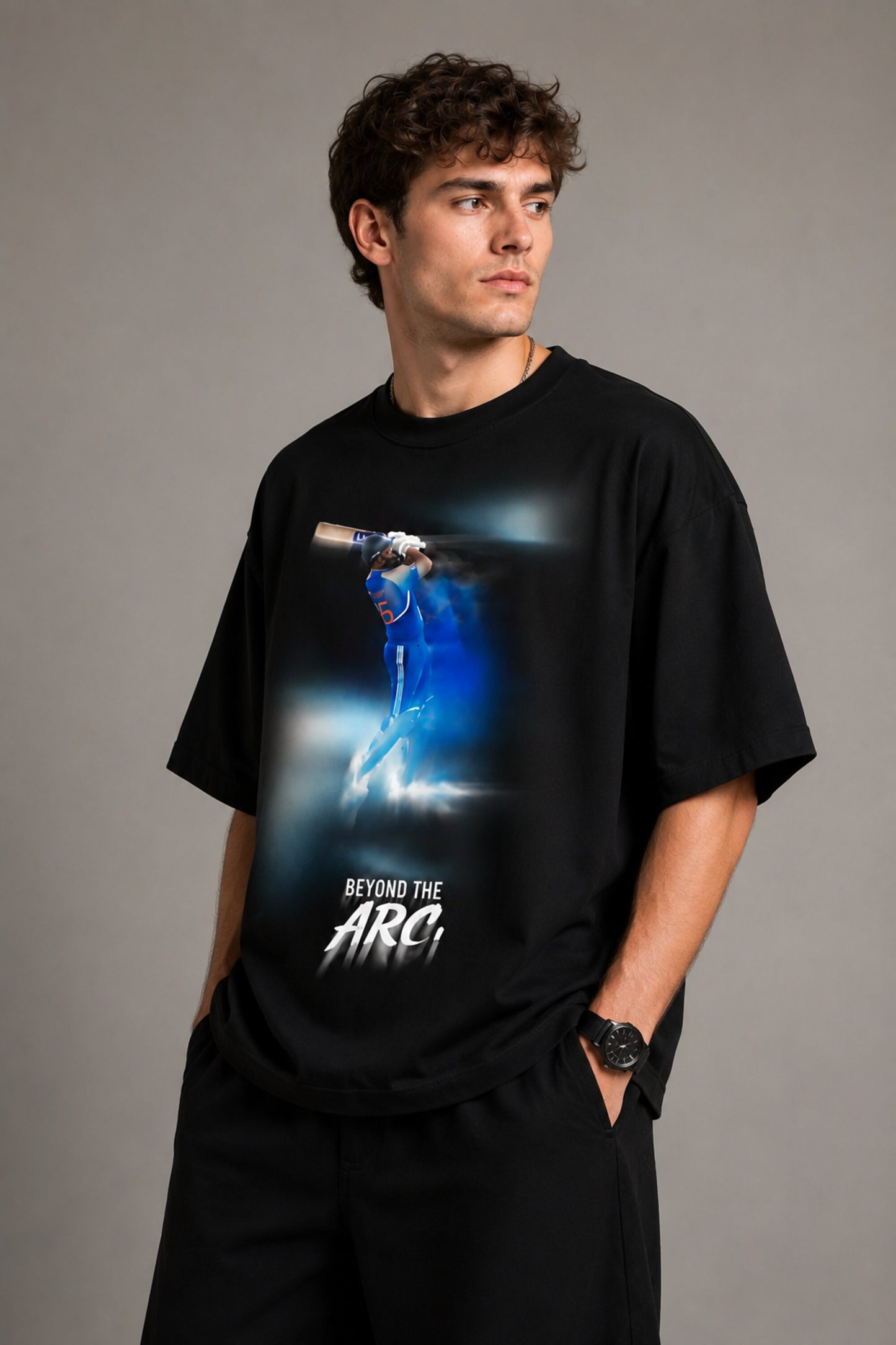 Black oversized t-shirt with cinematic Rohit Sharma Hitman batting photo blue glow Beyond the ARCi bold text 220 GSM DTF print