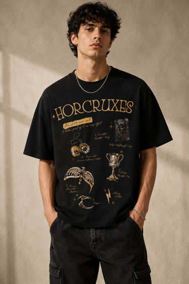 Beige oversized t-shirt with 'HORCRUXES' graphic and iconic Harry Potter items, showcasing premium cotton fabric and relaxed fit. - black