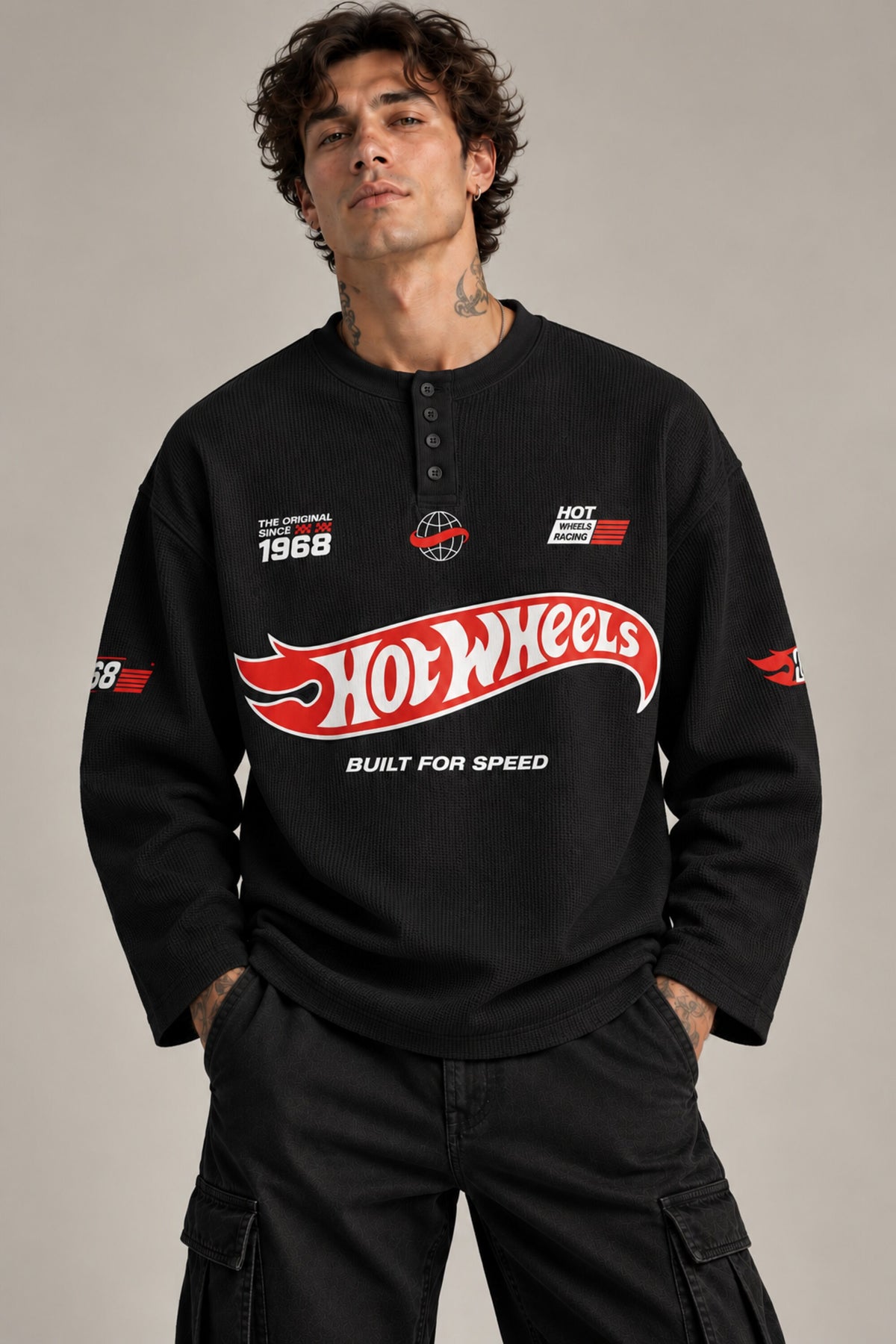 White waffle full sleeve boxy tshirt with Hot Wheels logo on chest and racing stripe sleeve print, henley collar, men India - black