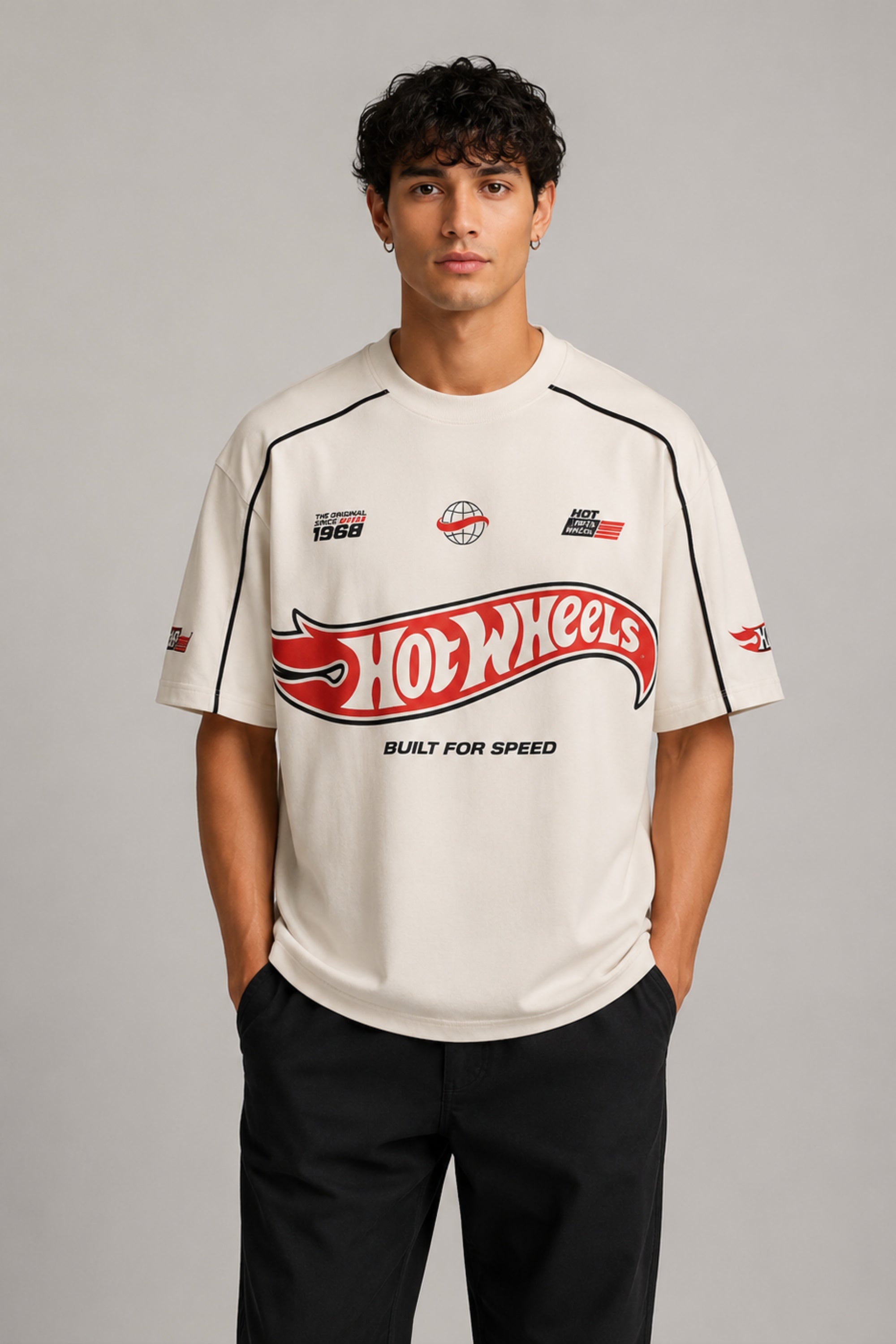 Beige oversized t-shirt with large red and black HOT WHEELS 'Original Since 1968' graphic print on the front, showcasing premium fabric texture. - beige