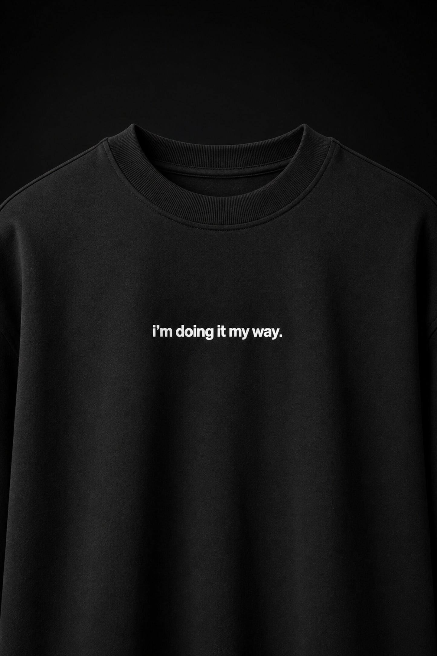 Black oversized t-shirt with i'm doing it my way minimalist white text chest print