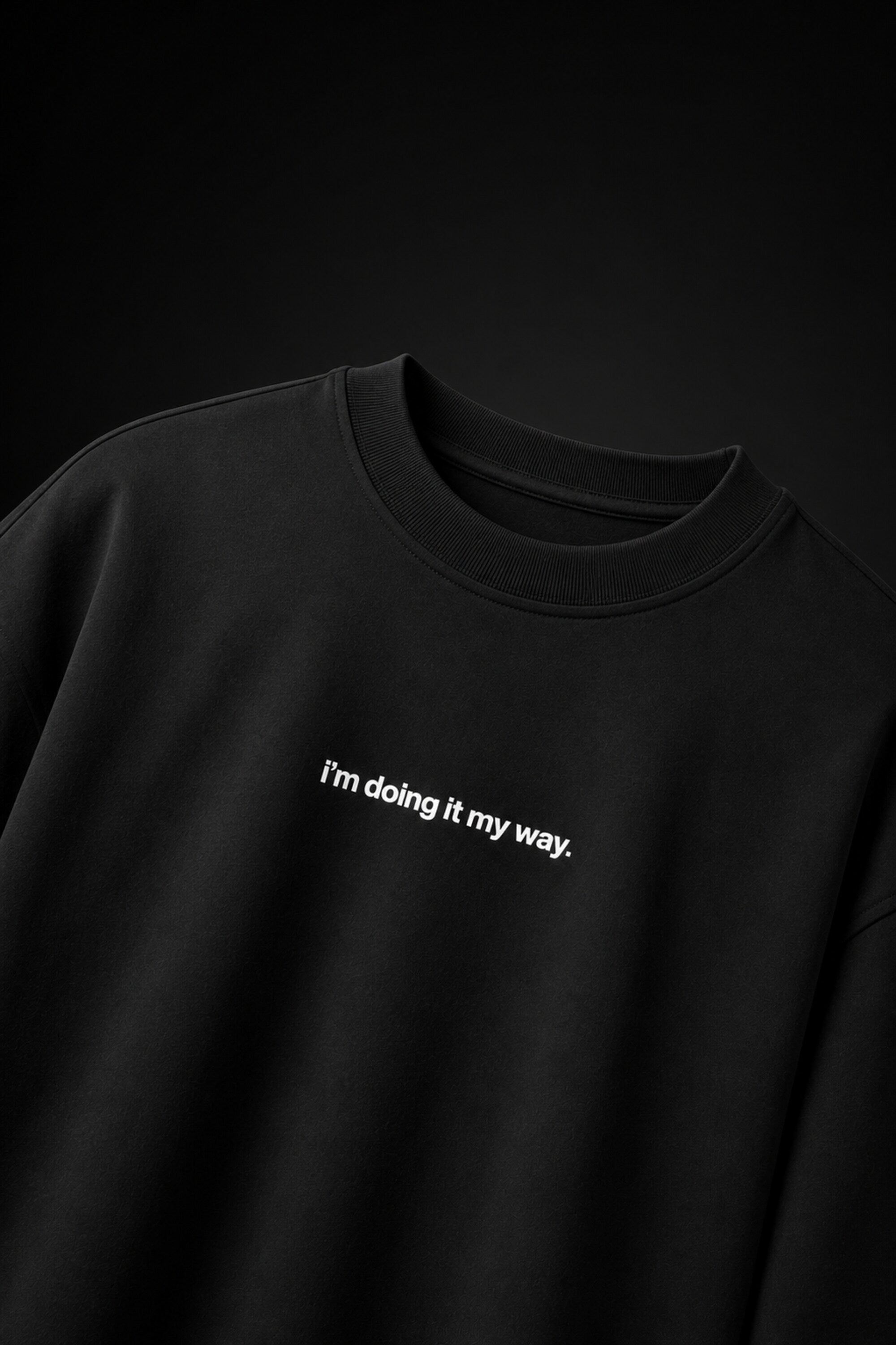 Black oversized t-shirt with i'm doing it my way minimalist white text chest print