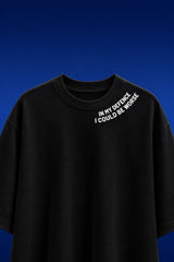White oversized t-shirt with In My Defence I Could Be Worse diagonal bold text print on chest, quote fashion India - black