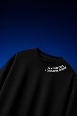 White oversized t-shirt with In My Defence I Could Be Worse diagonal bold text print on chest, quote fashion India