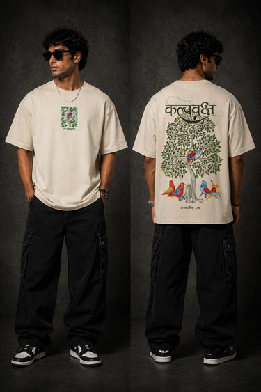 Man wearing a black Kalpvruksh oversized t-shirt with a colorful tree and bird graphic print on the back. Features Hindi script and 'The Wishing Tree' text. Streetwear style. - beige