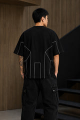 BLESS black oversized t-shirt with white graphic text 'DISCIPLINE TODAY FREEDOM TOMORROW' and abstract geometric lines.
