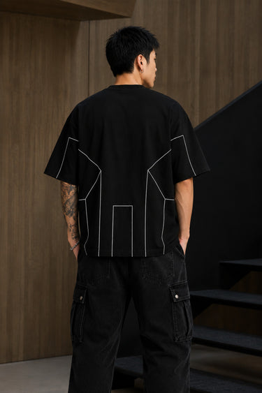 BLESS black oversized t-shirt with white graphic text 'DISCIPLINE TODAY FREEDOM TOMORROW' and abstract geometric lines.