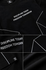 BLESS black oversized t-shirt with white graphic text 'DISCIPLINE TODAY FREEDOM TOMORROW' and abstract geometric lines.