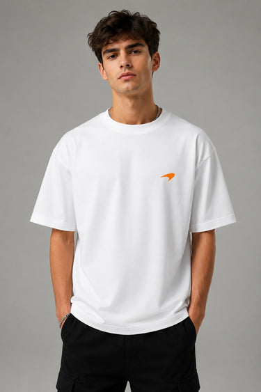 Model wearing white POPCASE Lando Norris McLaren oversized t shirt with orange speed mark logo on left chest