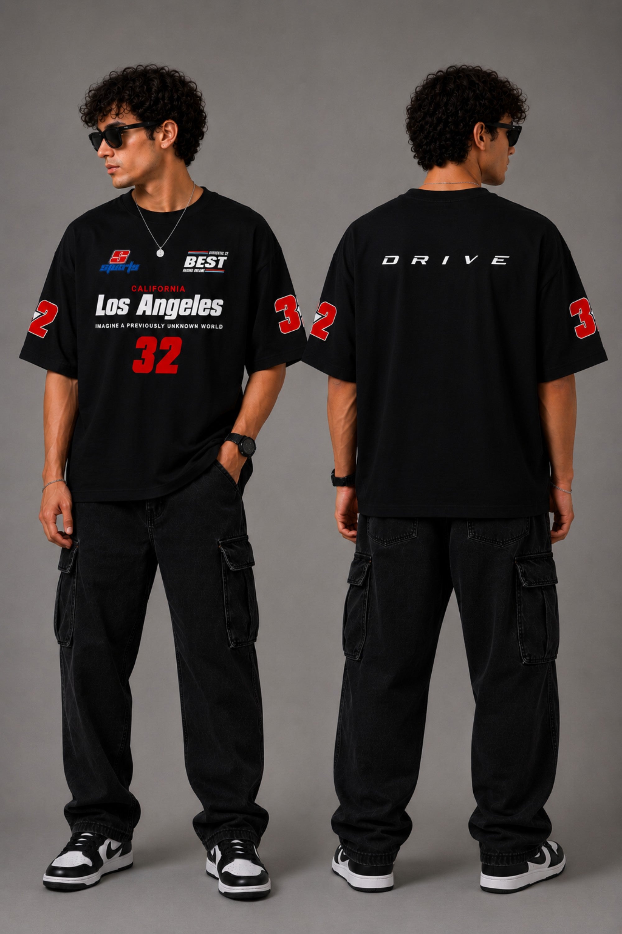 Back view of a man wearing a white LA 32 Drive oversized t-shirt with black text graphic. Model wears black cargo pants. - black
