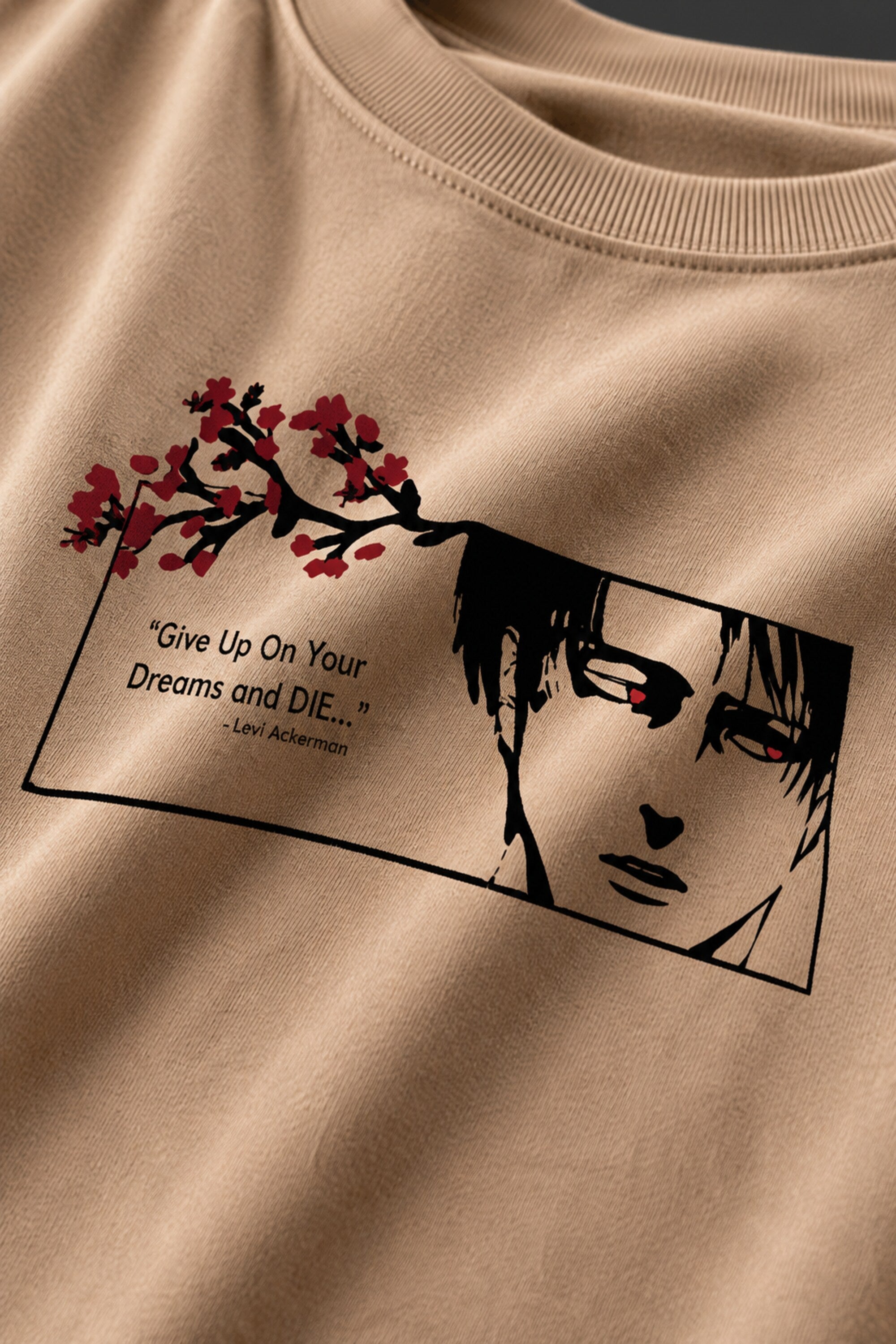 Beige oversized tshirt with Levi Ackerman manga face cherry blossom art and Give Up Your Dreams and Die quote from Attack on Titan