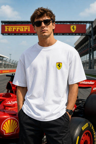 Model wearing white POPCASE Lewis Hamilton Ferrari oversized t shirt with Scuderia shield on chest and Lewis Hamilton Ferrari car back graphic