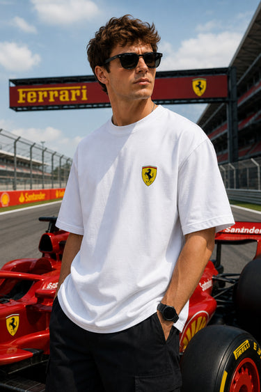 Model wearing white POPCASE Lewis Hamilton Ferrari oversized t shirt with Scuderia shield on chest and Lewis Hamilton Ferrari car back graphic